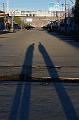089 Stan & Sam cast long shadows on the street in Gyantse